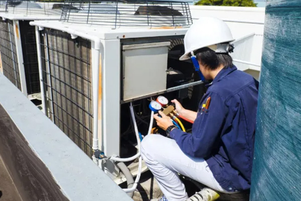 Tech working on commercial unit